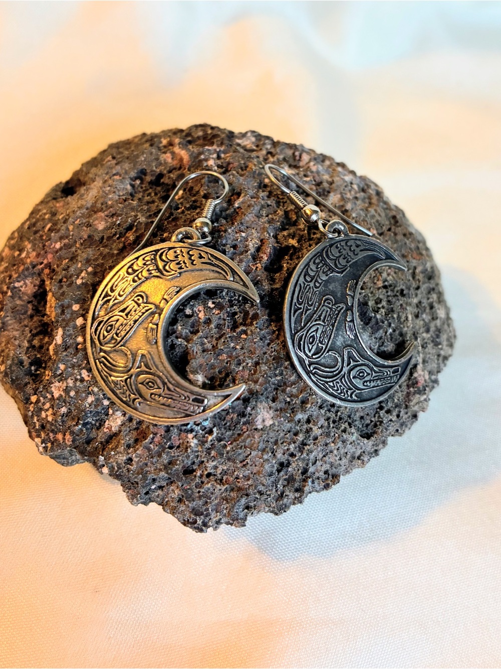 Silver tone crescent moon earrings with Northeastern Native American Design